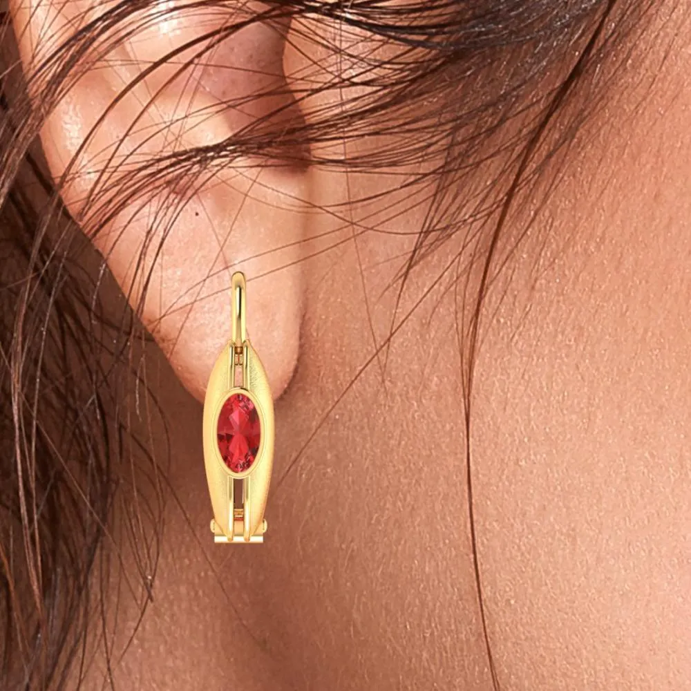 Circular Golden Earrings Set In 22k With A Stunning Red Stone