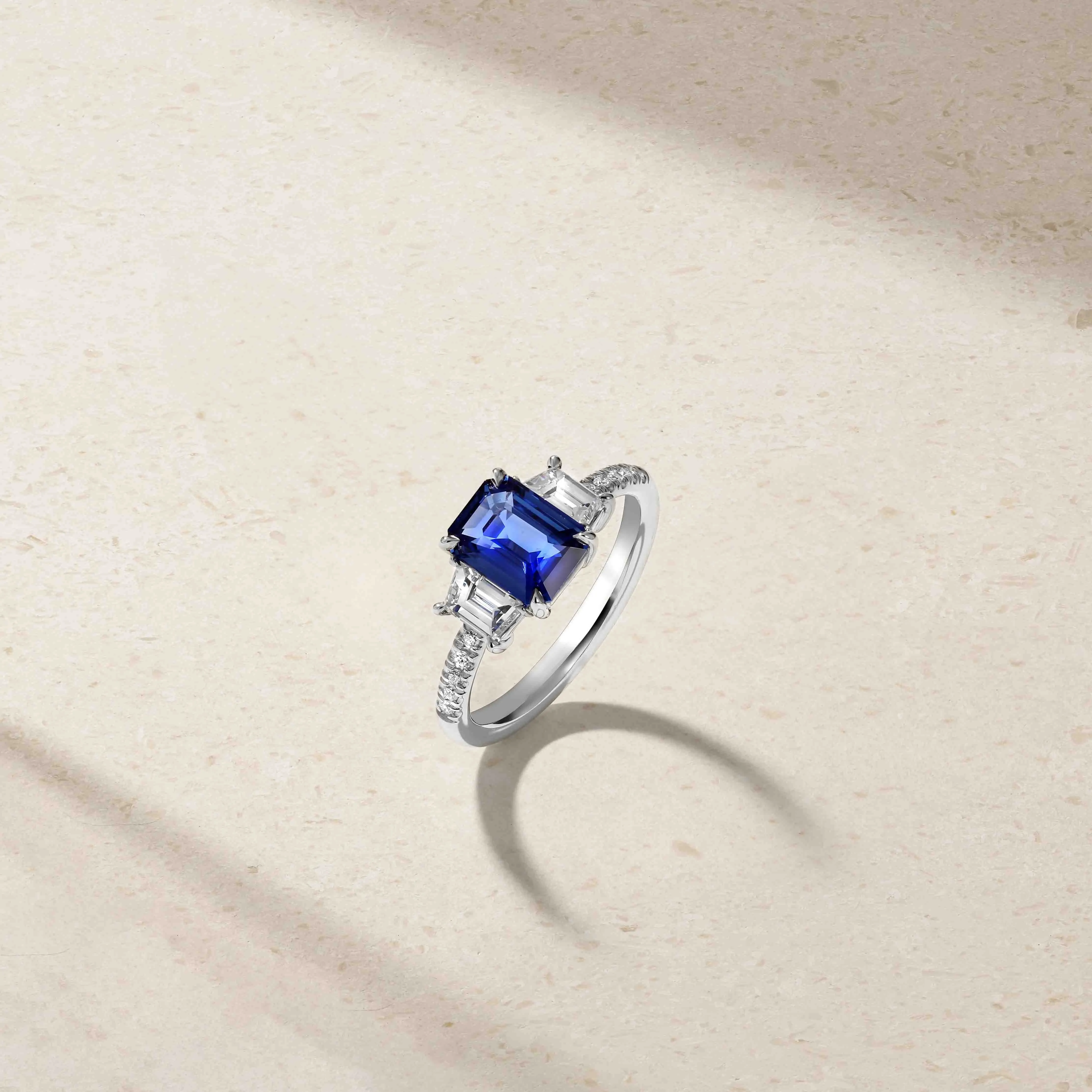 Nouveau Three Stone Emerald Cut Sapphire and Diamond Ring